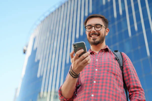 istock Young man with mobile phone 1410276240