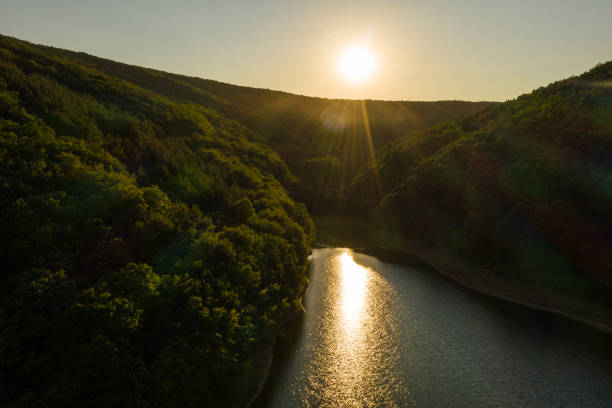 istock Drone view of lake between mountain, during sunset 1410277033