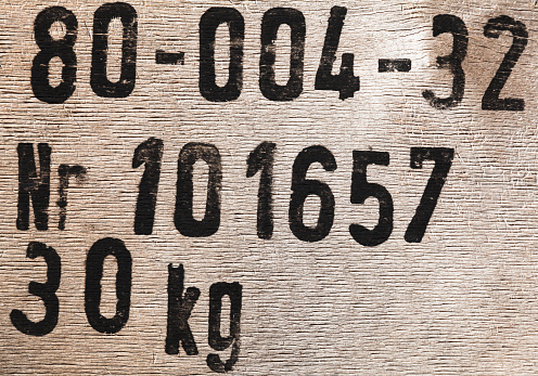 Wooden cargo box marking with fragment of a number and weight in kilograms