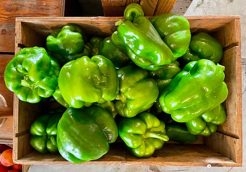Green Bell Pepper in a Wooden Crate