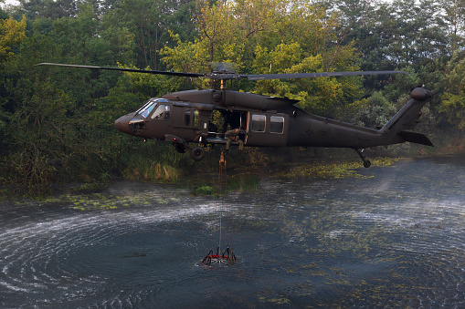 Slovak Military Air Force Chopper Used For Firefighting Purpose in a Large Scale Fire Blaze in Slovenian Karst - Here loading Water Form Vipava River