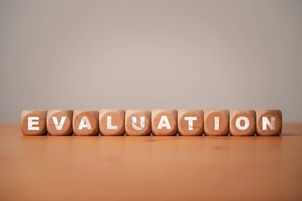 istock Evaluation wording print screen on wooden cube block for client customer survey concept. 1410280522