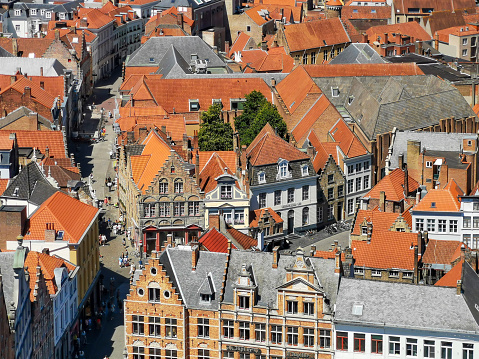 Bruges, Belgium. 16 July 2022. Aerial view of tourists visiting shops in central Bruges