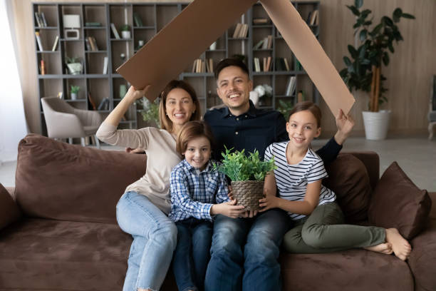 istock Happy bonding family relocating in new dwelling. 1410282313