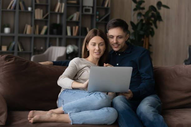 istock Happy bonding young family couple using computer. 1410282338