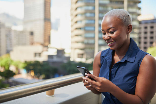 istock A young Black office worker texts during her coffee break on the balcony 1410282537