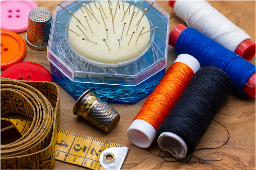 sewing material  Measuring tape, spools of thread, pins and thimbles.  haute couture