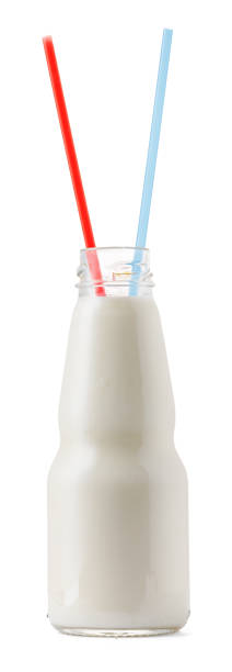 istock Glass cup of milk with a straw isolated on white 1410285533