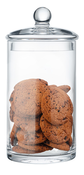 Glass storage jar for cookies isolated on white background