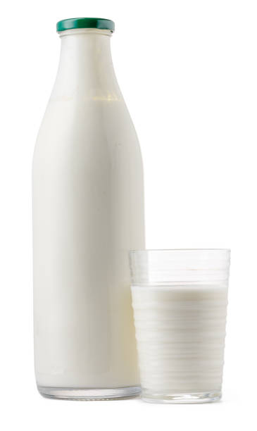 istock Glass bottle and cup of fresh milk isolated 1410287646