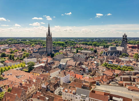 Three towers of Bruges from above with Belfry and Church of our Lady , Belgium