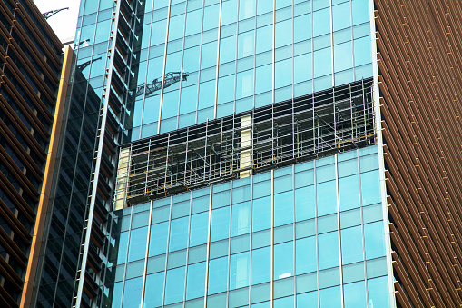 Reflections of modern commercial buildings on glasses