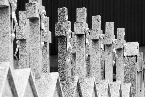View of a graveyard, rows of granite stone  crosses  on tombstones.  Monterroso, Lugo province, Galicia, Spain.