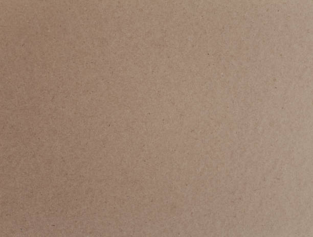 istock Paper background, top view close up. Horizontal brown craft paper texture. 1410294220