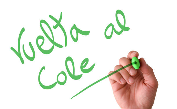 istock Hand writing in the air vuelta al cole with marker 1410295324