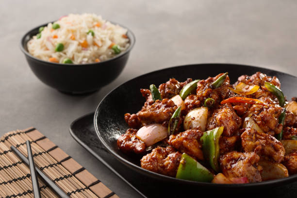 istock chicken chilli chinese with fried rice served in dish isolated on dark background side view 1410296494