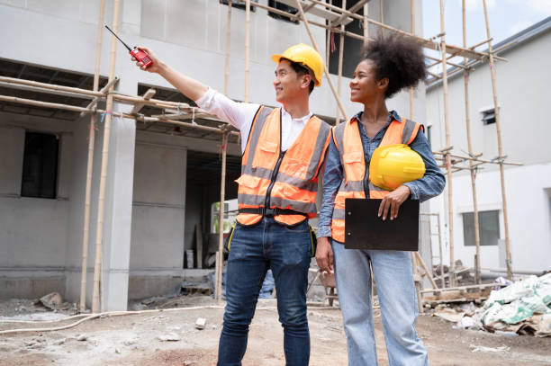 istock Mechanical Engineer team Working with walkie talkie and clipboard on construction home building site 1410297248