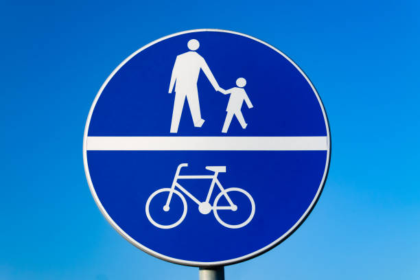 Road sign. Road for bicycles. Pedestrian way. Photo against a blue sky