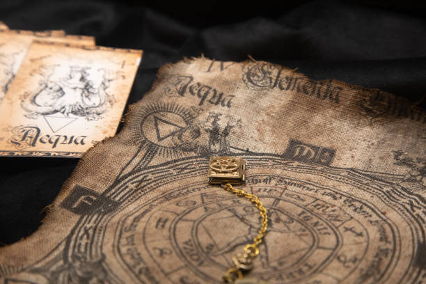 istock Ancient esoteric witchcraft background. Occultims and paganism old symbol, with mysterious runes alphabet 1410298840