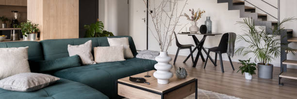 istock Sofa and dining table in room with stairs, panorama 1410299986