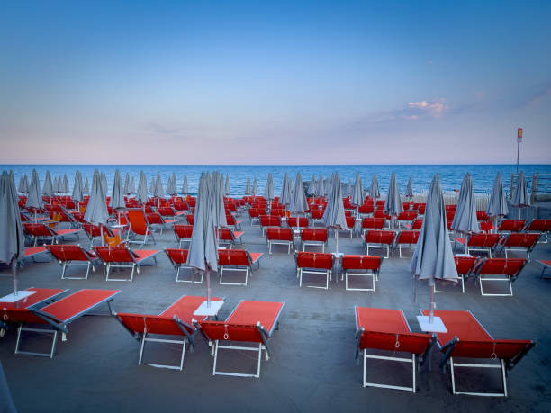 istock On a beach there are empty red beach chairs and umbrellas 1410301540
