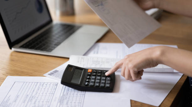 istock Accountant woman calculating expenses, fees, analyzing financial reports 1410301686