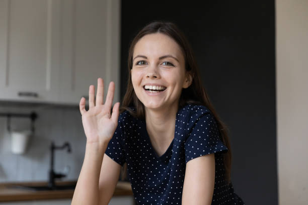 istock Cheerful young gadget user girl making video call 1410301696