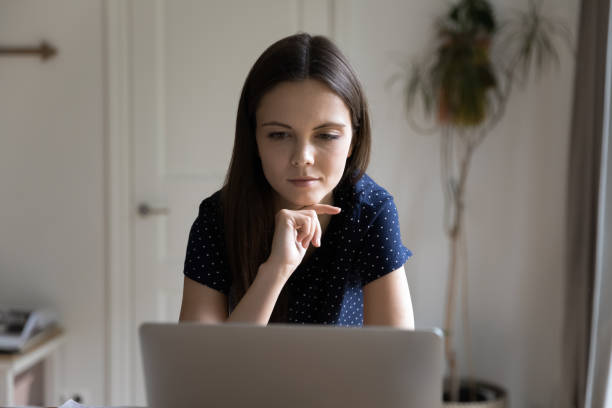 istock Thoughtful serious student girl thinking over research study 1410301701