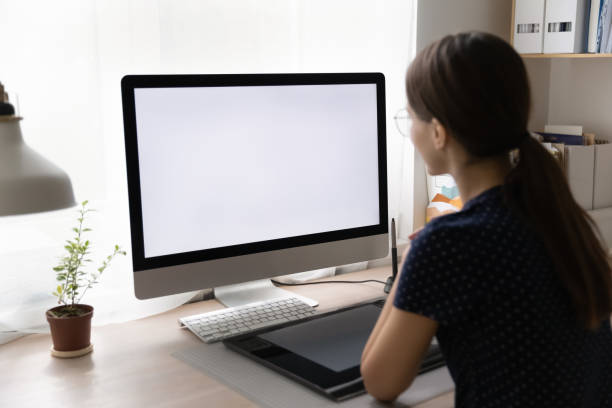 istock Young freelance employee working from home, sitting at workplace desk 1410302483