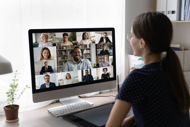 istock Young freelance employee talking to diverse business team 1410302484
