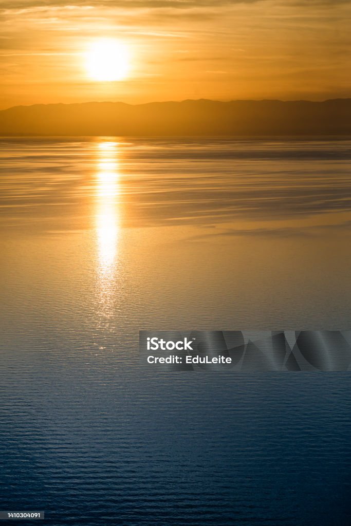 Sunset over lake Geneva Clear Sky Stock Photo