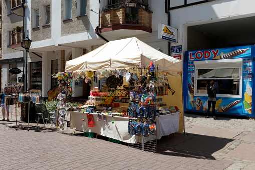Kolobrzeg, Poland - July 14, 2015: Various souvenirs offered for sale, the stand located at the famous pedestrian street in the Old Town district, among other offers the gifts and many small stuff