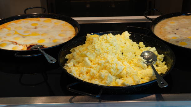 istock Fried and scrambled eggs and omelette in a self-service buffet with hot breakfast in the hotel. Continental breakfast concept. 1410304397