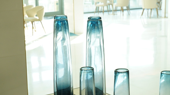 The interior of a hotel lobby. Decorative  Glass vases