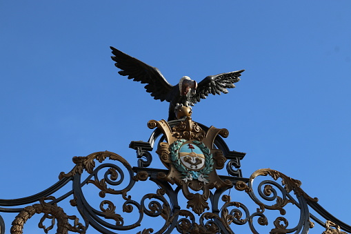 Condor and shield of Argentina, made of metal, at the entrance portal to a public park in Mendoza