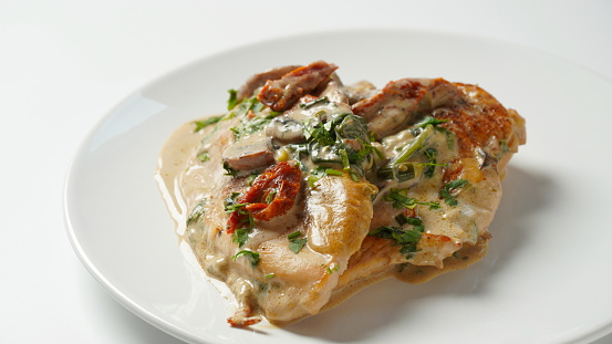 Creamy Italian Tuscan Chicken with Spinach and mushrooms, and sundried tomatoes