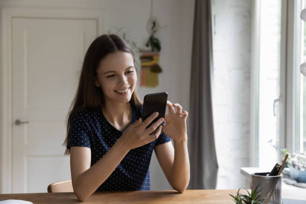 istock Happy millennial gen Z smartphone user chatting online 1410304956