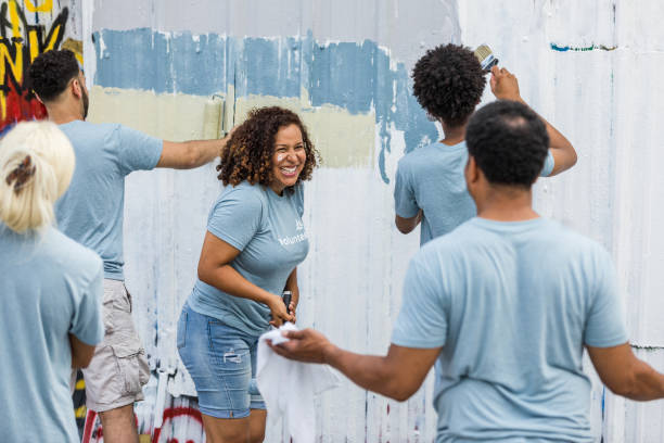 istock At volunteer event, wife laughs at unrecognizable husband 1410319970