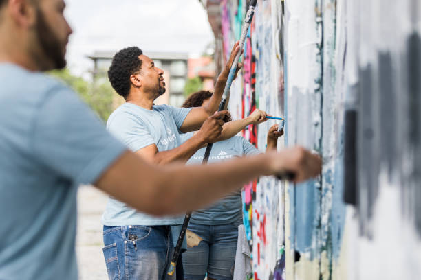 istock Volunteers meet at local park to paint over graffiti 1410319980