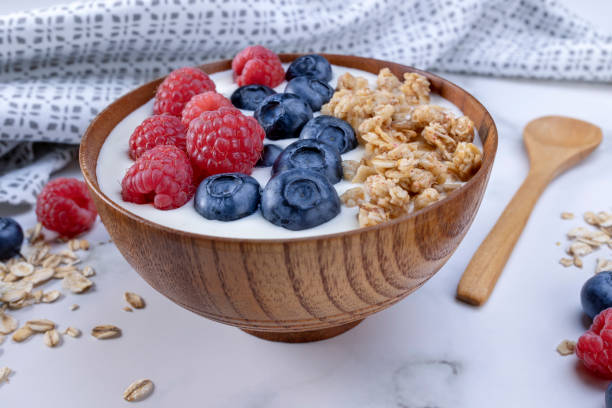 istock Serving yogurt with blueberry raspberry and oat flakes 1410321600