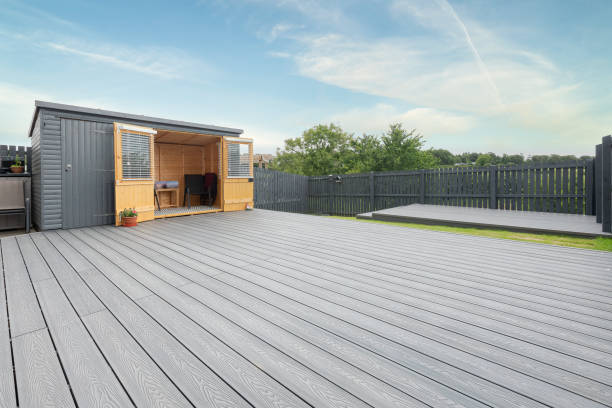 Newlly constructed decking over two levels with deck lighting installed and in Ash grey colour with summer house painted in the same matching colour.Good Image for a landscape Gardiner