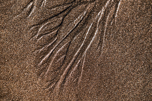 Interesting pattern made by water on the beach.