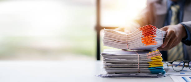 istock business documents businessman check legal document review Prepare documents or analysis reports, tax items, accounting documents, data contracts, office partner agreements. 1410322989