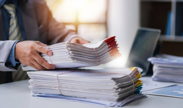 istock business documents businessman check legal document review Prepare documents or analysis reports, tax items, accounting documents, data contracts, office partner agreements. 1410322993