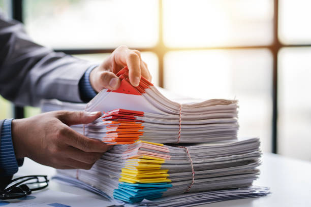 istock business documents businessman check legal document review Prepare documents or analysis reports, tax items, accounting documents, data contracts, office partner agreements. 1410323078