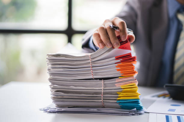 istock business documents businessman check legal document review Prepare documents or analysis reports, tax items, accounting documents, data contracts, office partner agreements. 1410323377