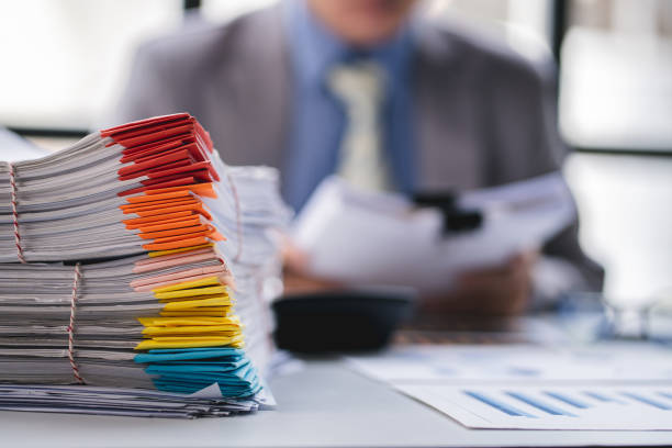 istock business documents businessman check legal document review Prepare documents or analysis reports, tax items, accounting documents, data contracts, office partner agreements. 1410323448