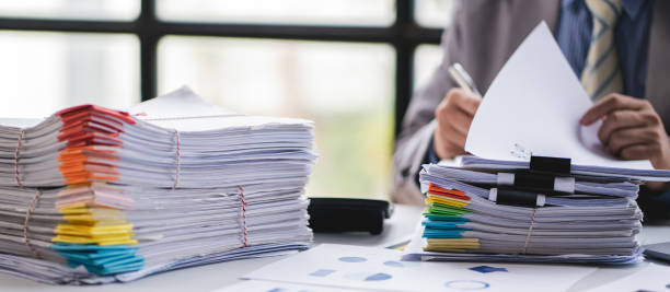 istock business documents businessman check legal document review Prepare documents or analysis reports, tax items, accounting documents, data contracts, office partner agreements. 1410323688