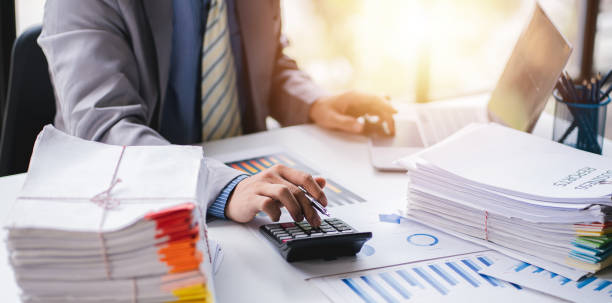 istock business documents businessman check legal document review Prepare documents or analysis reports, tax items, accounting documents, data contracts, office partner agreements. 1410323736