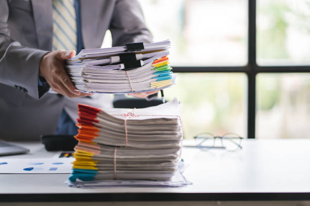 istock business documents businessman check legal document review Prepare documents or analysis reports, tax items, accounting documents, data contracts, office partner agreements. 1410324356